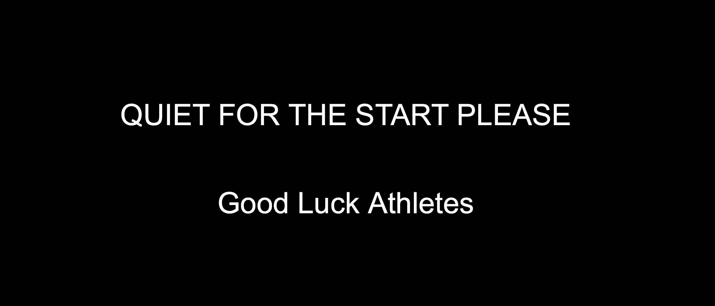 Text display reading “Quiet for the start please. Good luck athletes”